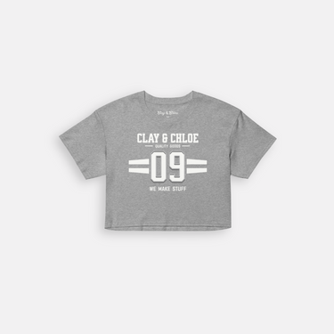 gray tee with white font clay and Chloe crop top logo 