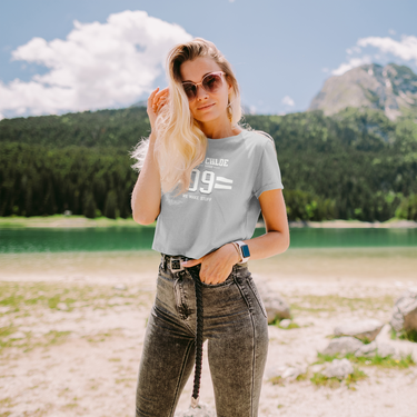 model wearing gray tee with white font clay and Chloe crop top logo 