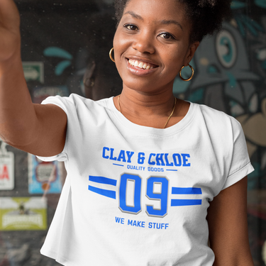 model wearing white crop top with blue font clay and Chloe logo 