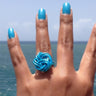 Turquoise anodized aluminum wire wrap ring.