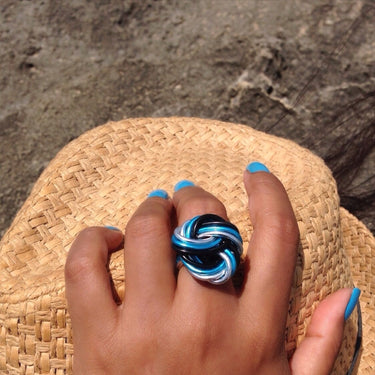 Silver, turquoise, and black color anodized aluminum wire wrap ring. 
