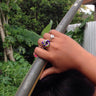 Purple and green anodized aluminum wire wrap ring.
