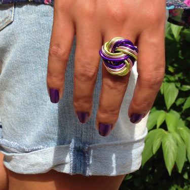 Purple, pink, and light green color anodized aluminum wire wrap ring.