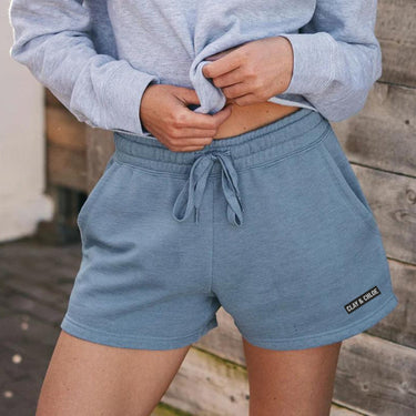 model wearing misty blue CLAY & CHLOE CALI WASH SHORTS