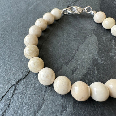 beige color bead bracelet for men