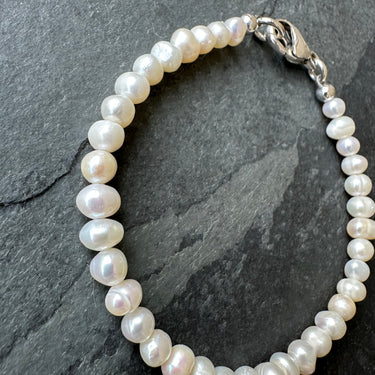 side view of FRESHWATER PEARL BEAD BRACELET handcrafted for men