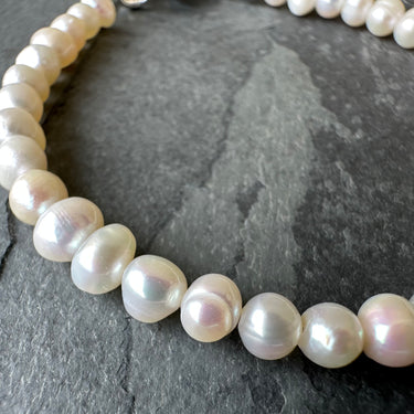 close up of white freshwater pearl bracelet 