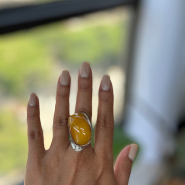 curve African amber ring