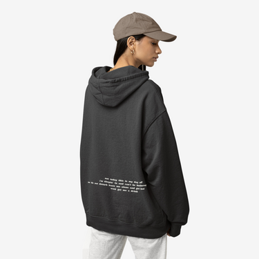 model wearing READY NEVER HOODIE with paragraph on the back