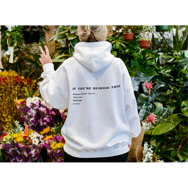 white hoody with saying on the back 