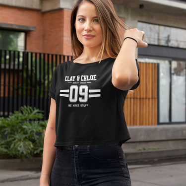 model wearing black crop top with white font clay and Chloe logo 