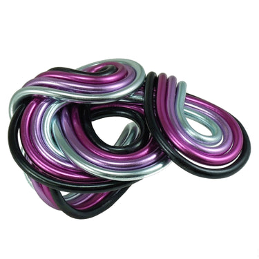 Black, fuchsia, lavender, and light color anodized aluminum wire wrap ring.
