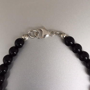 BEAD NECKLACE WITH BLACK ONYX close up of the clasp and beads