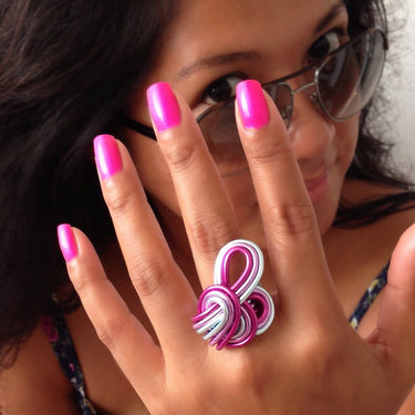 Fuchsia, light pink, and light blue color anodized aluminum wire wrap ring.