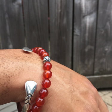 carnelian bead bracelet with silver accent on model