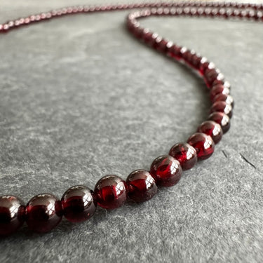 close up view of 4mm BEAD NECKLACE WITH GARNET