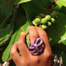 Light green, purple, and pink color anodized aluminum wire wrap ring.