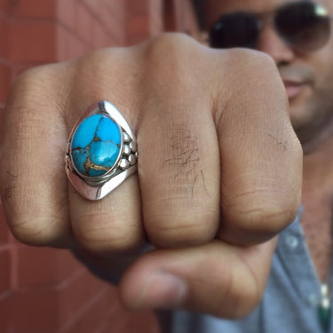 handcrafted turquoise and sterling silver mens ring on model 