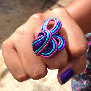 Turquoise, hot pink, and purple color anodized aluminum wire wrap ring.