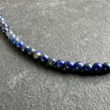 zoom view of blue beads use for minimalist necklace for men