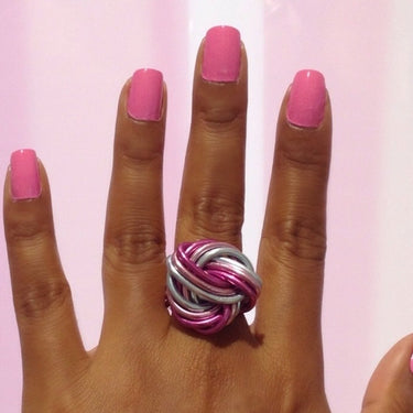Fuchsia, pink, and light blue color anodized aluminum wire wrap ring.