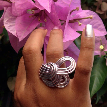 Light pink anodized aluminum wire wrap ring. 

