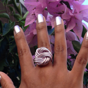 Pink anodized aluminum wire wrap ring.