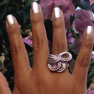 Pink anodized aluminum wire wrap ring.