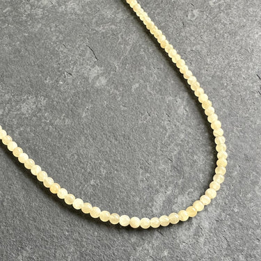 side view of yellow jade necklace for men