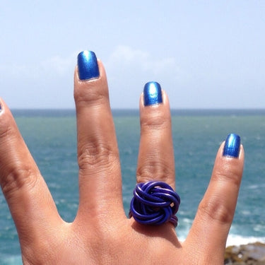 Dark blue color anodized aluminum wire wrap ring.           
