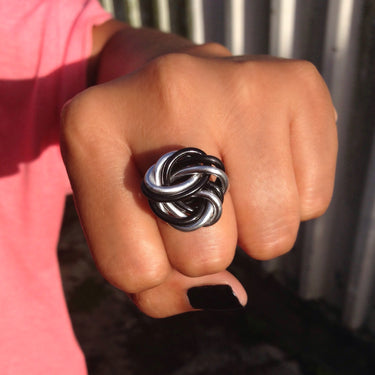 Silver and black anodized aluminum wire wrap ring.