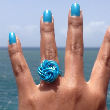 Turquoise anodized aluminum wire wrap ring.