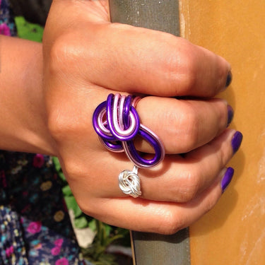Purple and pink color anodized aluminum wire wrap ring. 
