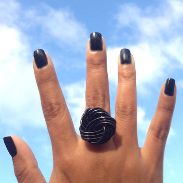 Black color anodized aluminum wire wrap ring.
