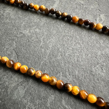 closeup view of BEAD NECKLACE WITH TIGER’S EYE