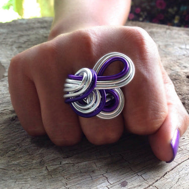 Silver and purple color anodized aluminum wire wrap ring. 
