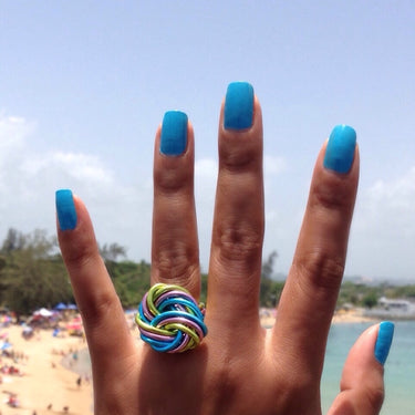 Light green, pink, and turquoise color anodized aluminum wire wrap ring. 
