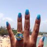 Light green, pink, and turquoise color anodized aluminum wire wrap ring. 
