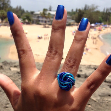Dark blue and turquoise color anodized aluminum wire wrap ring. 
