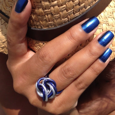 Dark blue and silver color anodized aluminum wire wrap ring. 

