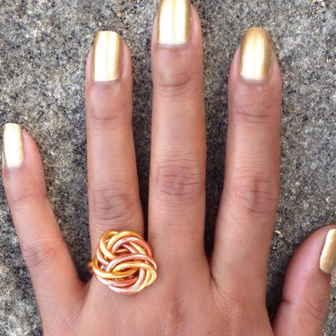 Gold and copper color anodized aluminum wire wrap ring. 
