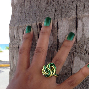 Light green and dark green color anodized aluminum wire wrap ring. 

