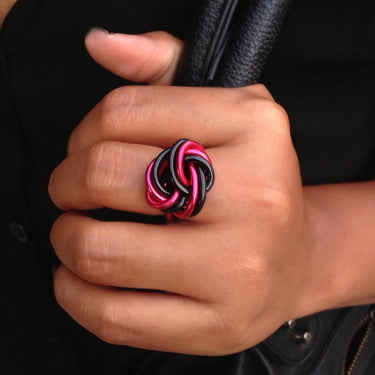 Black and red color anodized aluminum wire wrap ring. 
