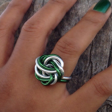 Dark green and silver color anodized aluminum wire wrap ring. 
